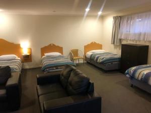 Postel nebo postele na pokoji v ubytování Sheffield Motor Inn