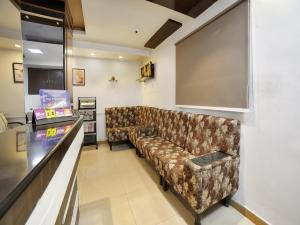 a lobby with a couch in a waiting room at Hotel New Sree Krishna Residency in Hyderabad