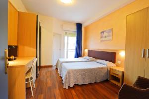 Кровать или кровати в номере Hotel Grifone