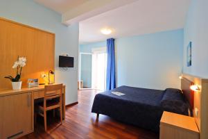 Телевизор и/или развлекательный центр в Hotel Grifone