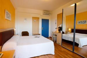 Кровать или кровати в номере Hotel Grifone