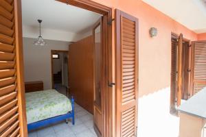A bed or beds in a room at La Bitta