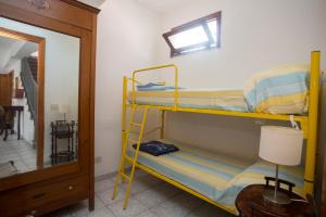 A bed or beds in a room at La Bitta