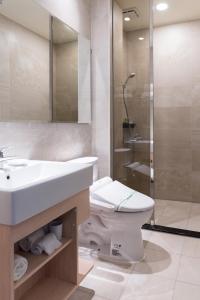 Kylpyhuone majoituspaikassa Tianli Hotel