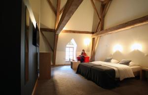 Letto o letti in una camera di Hotel The Lodge Heverlee