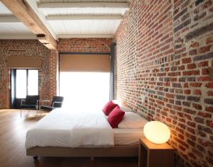 Letto o letti in una camera di Hotel The Lodge Heverlee