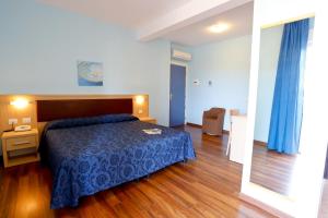 Кровать или кровати в номере Hotel Grifone