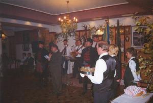 a group of people standing in a room with a cake at Guest House Prepelica in Prelog