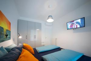 Posteľ alebo postele v izbe v ubytovaní Cipriani 5 RivieraHoliday