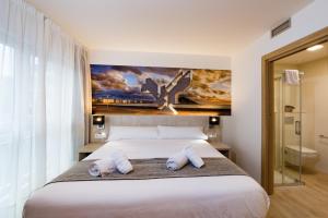 Postel nebo postele na pokoji v ubytování Atotxa Rooms