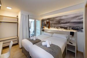 Postel nebo postele na pokoji v ubytování Atotxa Rooms