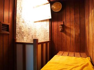 เตียงในห้องที่ Wisterian Life Club Usami
