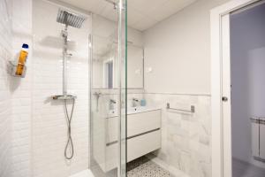 a bathroom with a shower and a sink at Realejo Horizon por Miwa Studio in Granada +63 photos