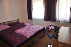 Postel nebo postele na pokoji v ubytování Gästezimmer Michelangelo