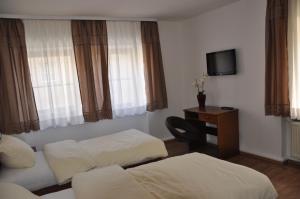 Postel nebo postele na pokoji v ubytování Gästezimmer Michelangelo