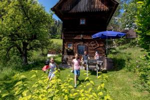 a group of people standing in front of a cabin at Chalet "Knusperhäuschen" in Murau