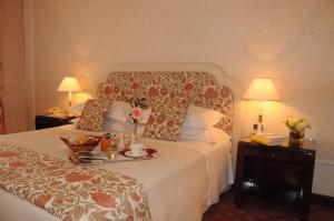 Letto o letti in una camera di Hotel De La Ville