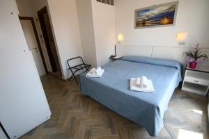 Letto o letti in una camera di Hotel Tre Assi