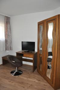 TV a/nebo společenská místnost v ubytování Gästezimmer Michelangelo
