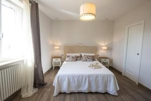 Postel nebo postele na pokoji v ubytování Santa Lucia B&B