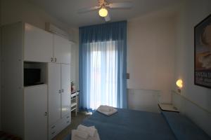 Letto o letti in una camera di Hotel Tre Assi