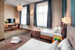 Posteľ alebo postele v izbe v ubytovaní Hotel Unicus Krakow Old Town - Destigo Hotels
