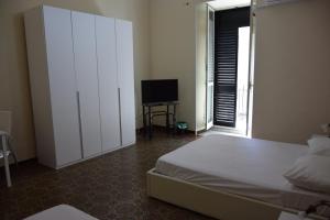 Postel nebo postele na pokoji v ubytování casa Giuseppe