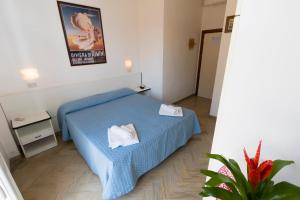 Letto o letti in una camera di Hotel Tre Assi