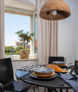 a dining room table with a plate of food on it at Close&Cosy in Dubrovnik