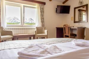 Postel nebo postele na pokoji v ubytování Hotel Zlatni bor