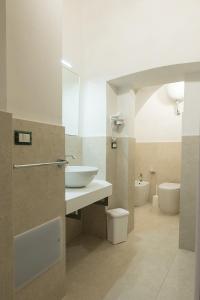 a bathroom with a sink and a toilet at Charme B&B Dimora Quarta in Leverano +61 photos