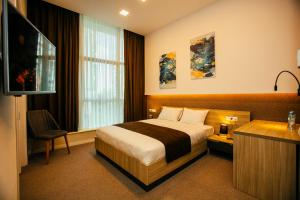 Кровать или кровати в номере Hotel West Batumi