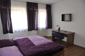 Postel nebo postele na pokoji v ubytování Gästezimmer Michelangelo