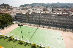 
a tennis court with a tennis racket on top of it at Hotel Don Juan Tossa in Tossa de Mar
