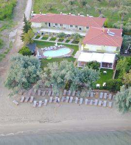 an aerial view of a house with a swimming pool at Hotel Stella in Skala Rachoniou
