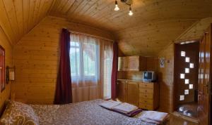 Postel nebo postele na pokoji v ubytování Pensiunea Moldovan
