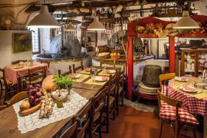 a restaurant with a long table with vegetables on it at La Casa del Cavaliere in Borgomaro
