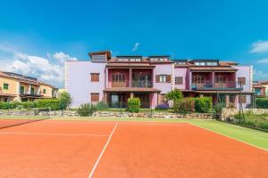 a tennis court in front of a building at Apartment Gordana Ghedda in Nova Vas