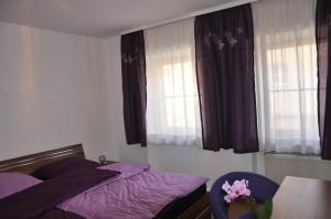 Postel nebo postele na pokoji v ubytování Gästezimmer Michelangelo