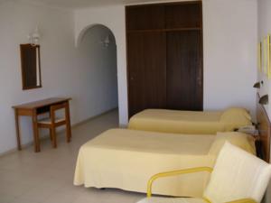 Кровать или кровати в номере Don Tenorio Aparthotel