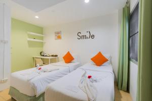 Кровать или кровати в номере Little Home Ao Nang