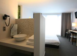 Ein Bett oder Betten in einem Zimmer der Unterkunft Hotel De Groene Hendrickx