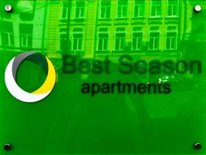 a green and yellow building with graffiti on it at Best Season Apart Hotel in Kyiv