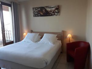 Postel nebo postele na pokoji v ubytování L'Oasis