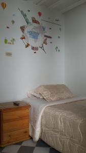 a bedroom with a bed and a sign on the wall at La Casa De Huespedes in Bogotá +5 photos