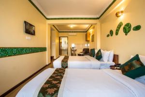 Tempat tidur dalam kamar di Hotel Yukhang