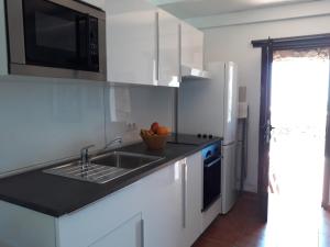 Kuchyň nebo kuchyňský kout v ubytování Loft La Tahonilla