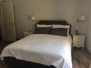 A bed or beds in a room at Taverna del Puccini