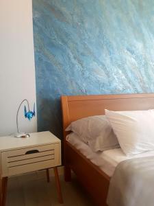 Postel nebo postele na pokoji v ubytování Apartment Eva