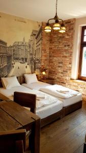 Łóżko lub łóżka w pokoju w obiekcie Willa Stara Przepompownia